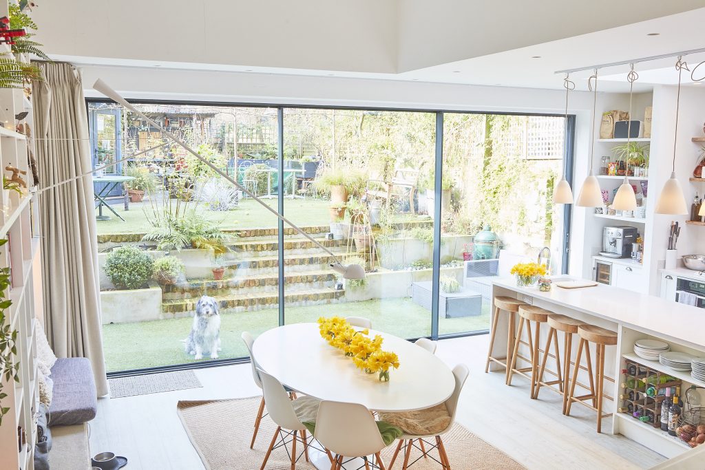 a dining room table in front of a window