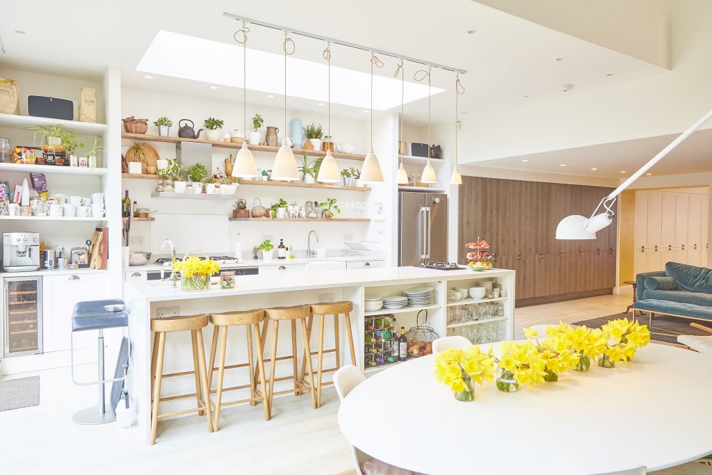 a kitchen filled with lots of furniture