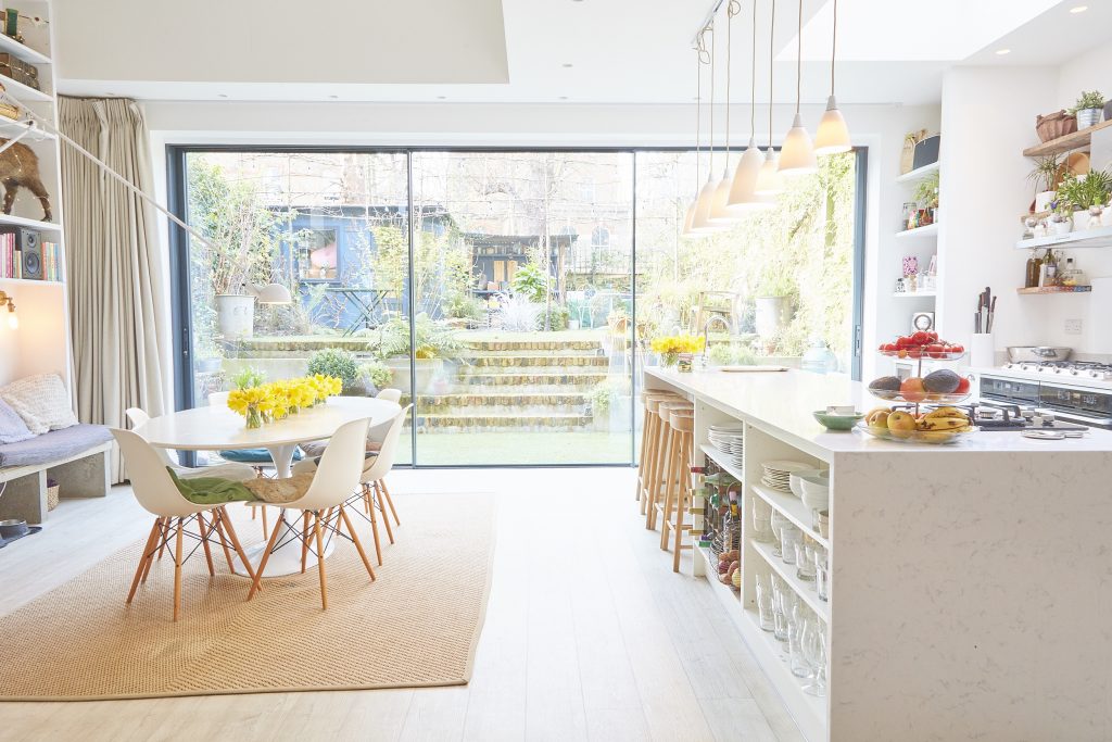 a room filled with furniture and a large window
