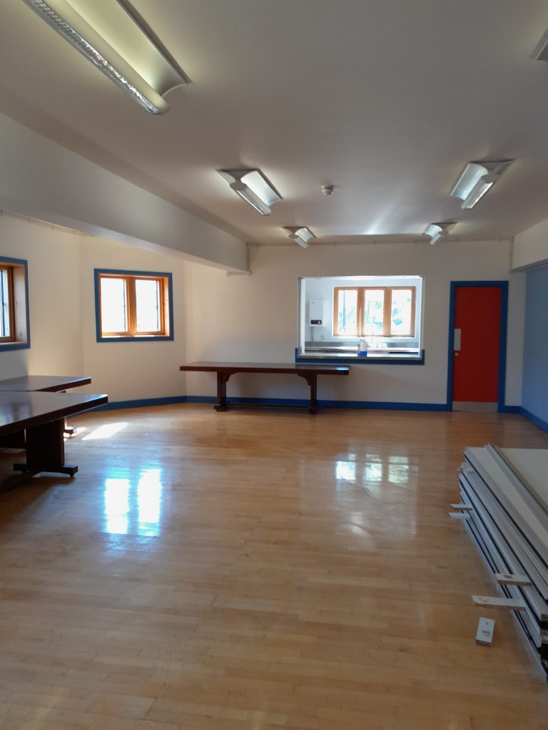 a view of a living room with a wooden floor