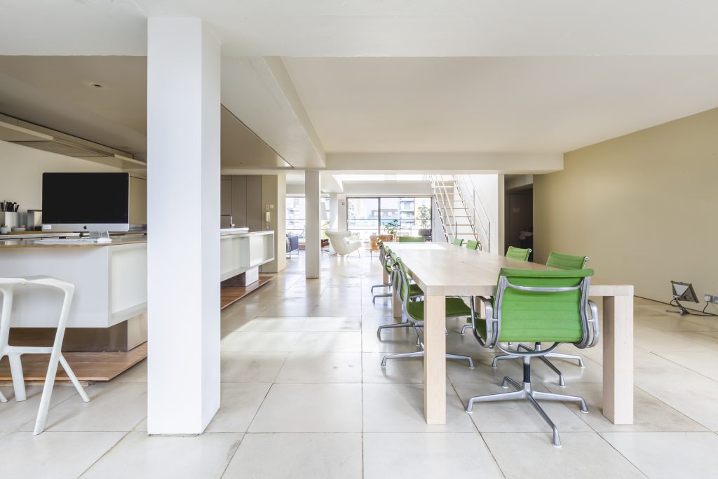 a room filled with furniture and a large window