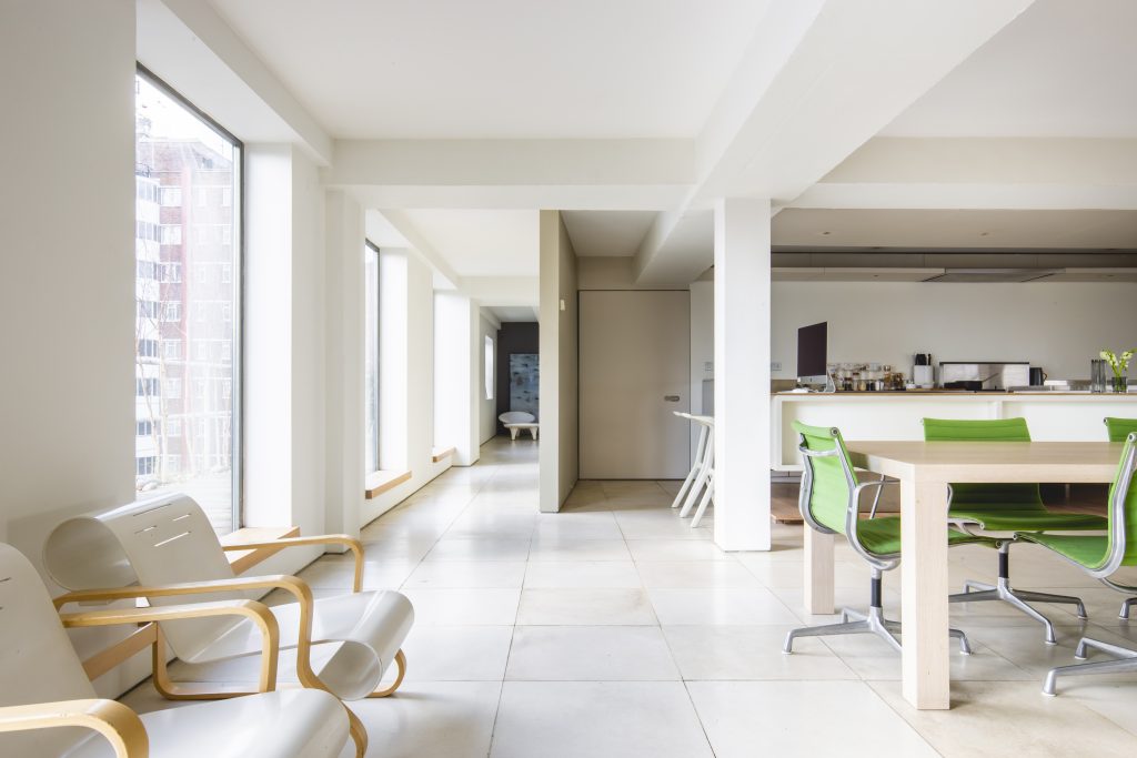 a room filled with furniture and a sink