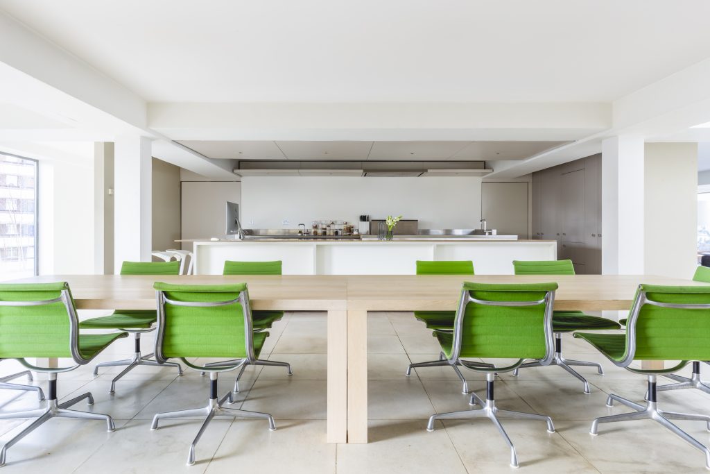a living room filled with furniture and a large window