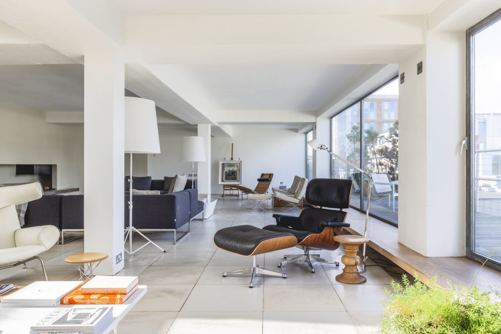 a room filled with furniture and a large window