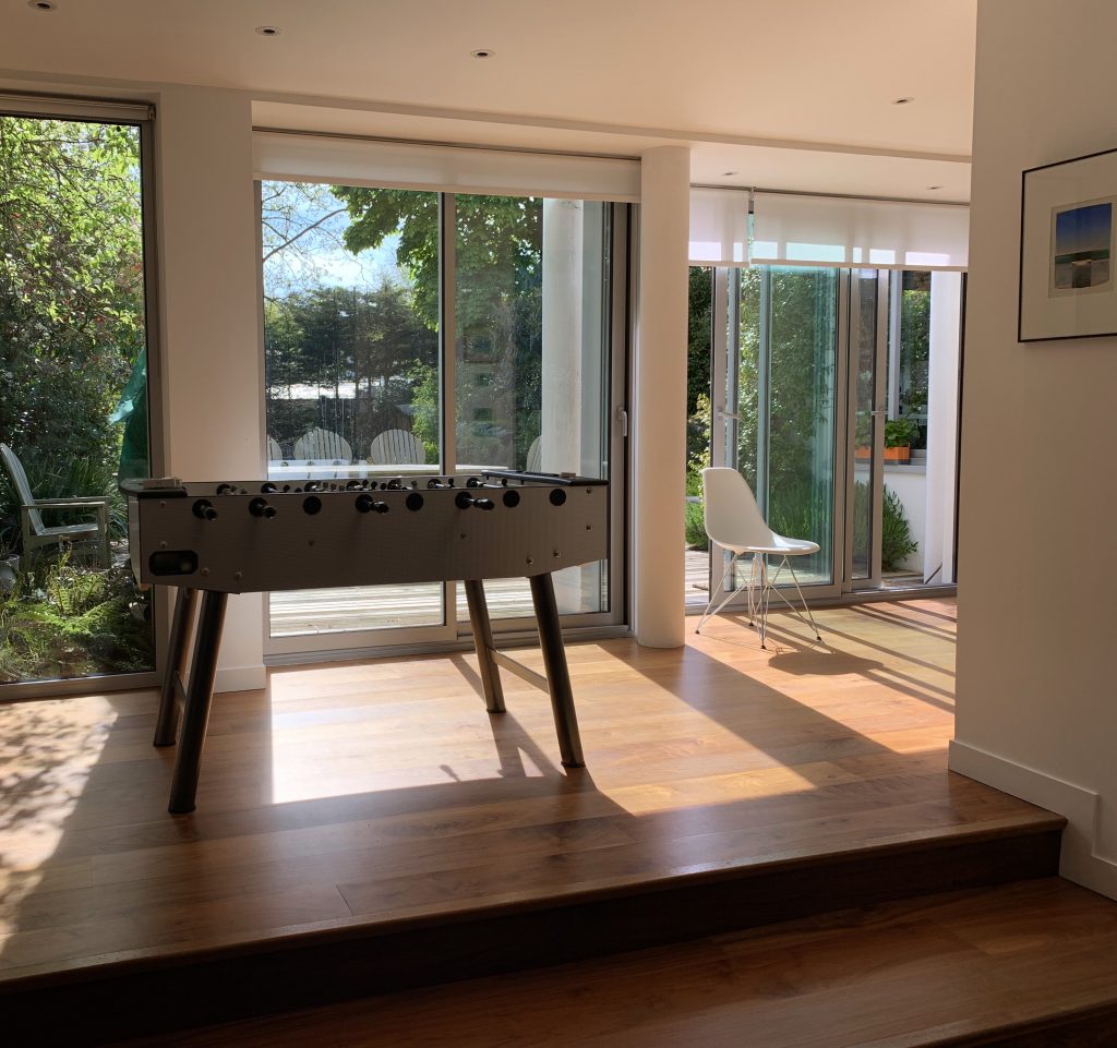 a living room filled with furniture and a large window