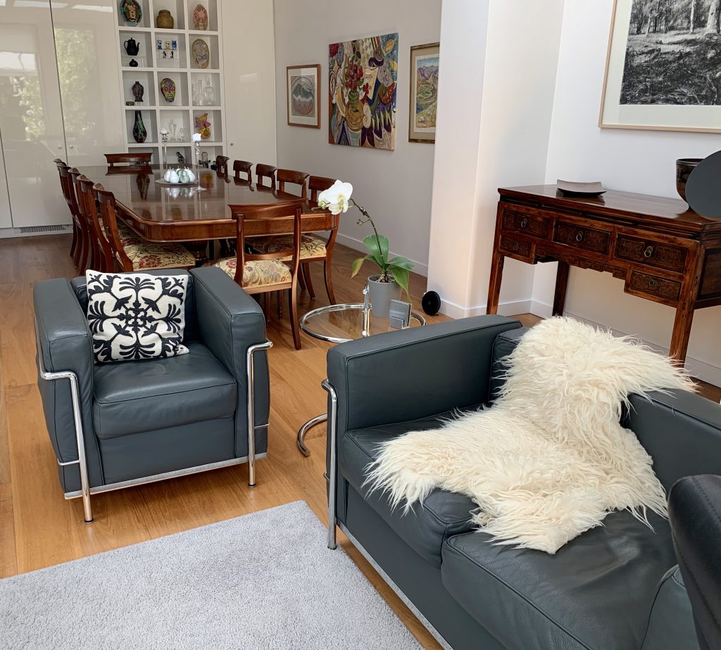 a living room filled with furniture and a fireplace