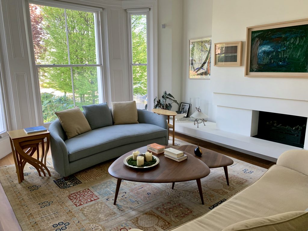a living room filled with furniture and a large window