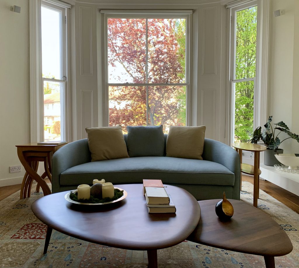 a living room filled with furniture and a large window