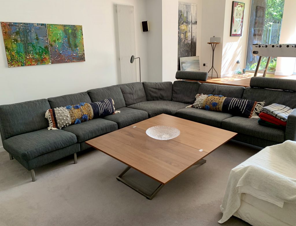 a living room filled with furniture and a table