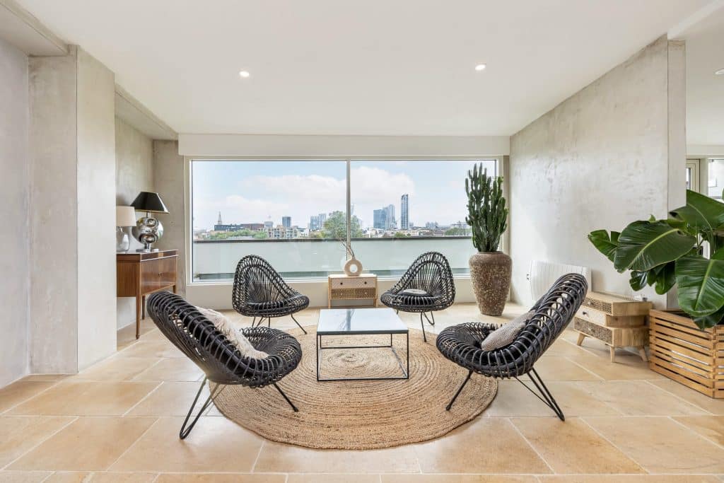 a room filled with furniture and a large window