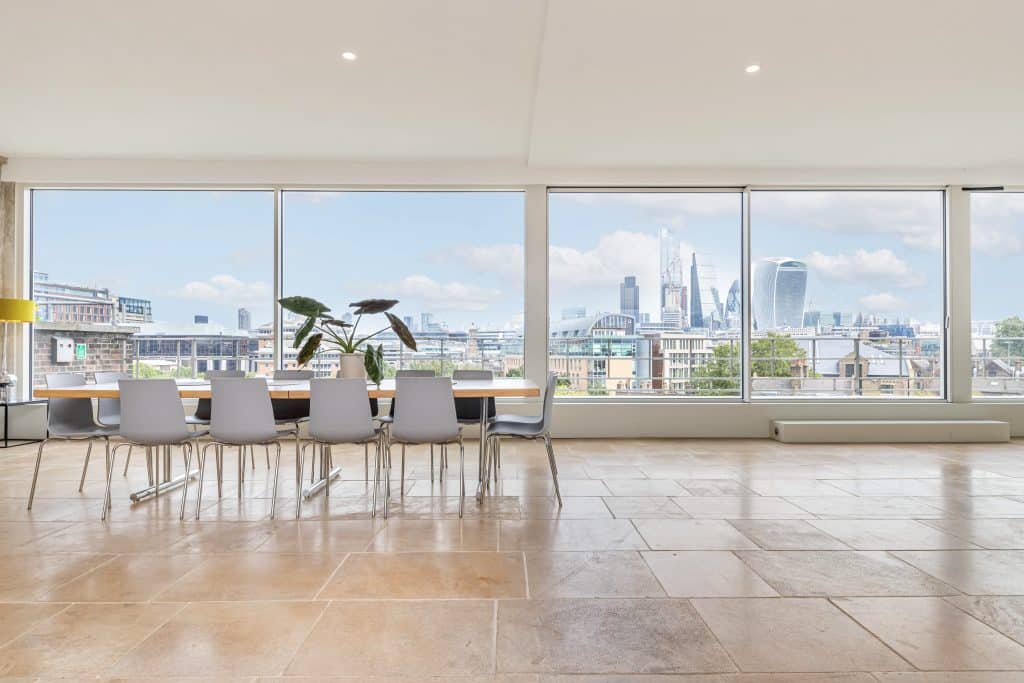 a room filled with furniture and a large window