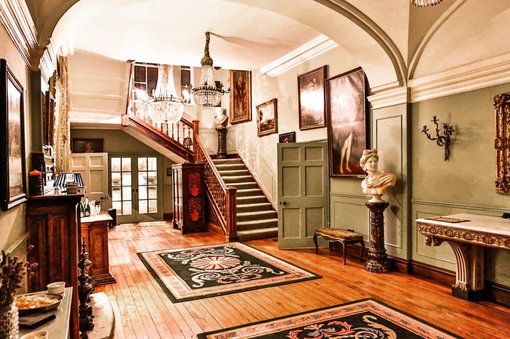 a room filled with furniture and a fireplace