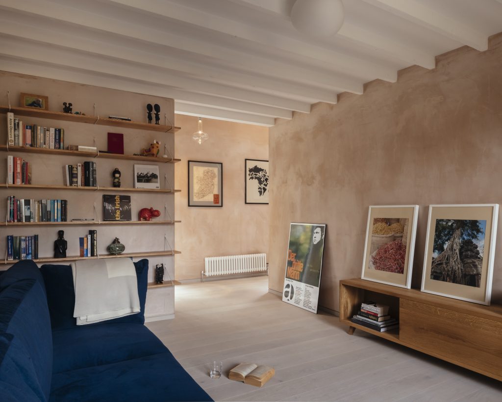 a living room filled with furniture and a fireplace