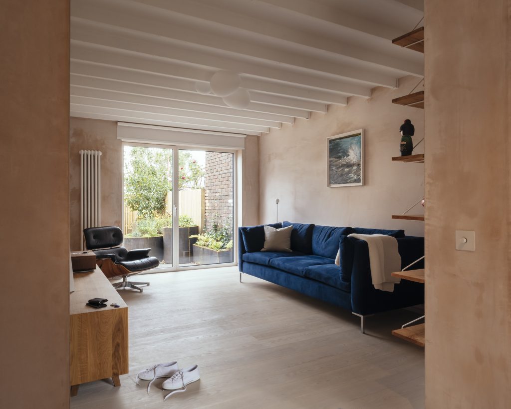 a living room filled with furniture and a large window