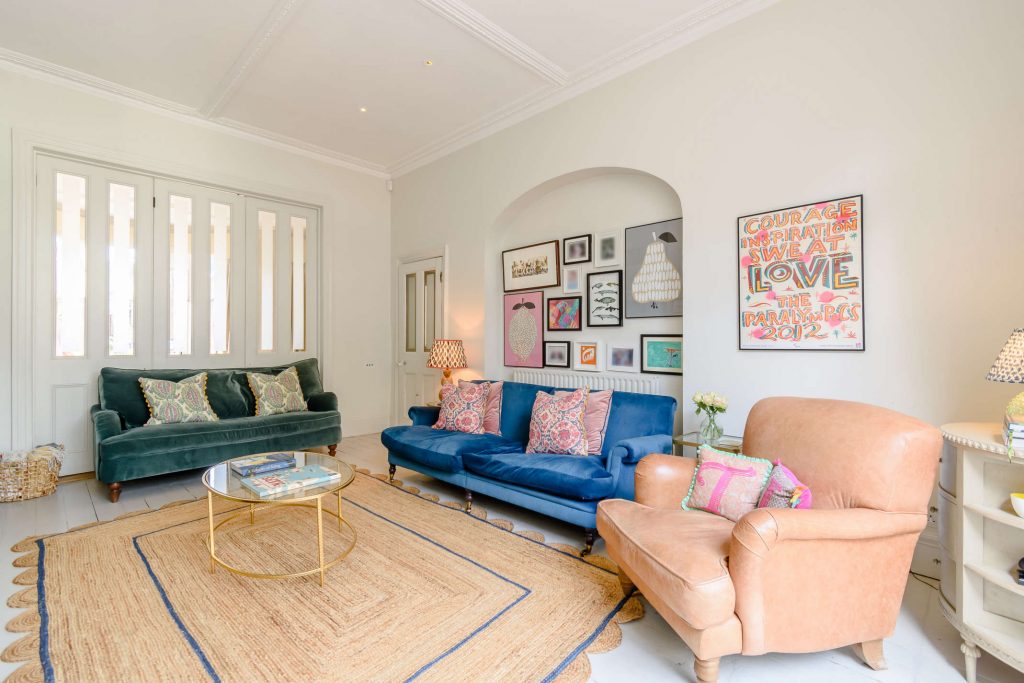 a living room filled with furniture and a fireplace