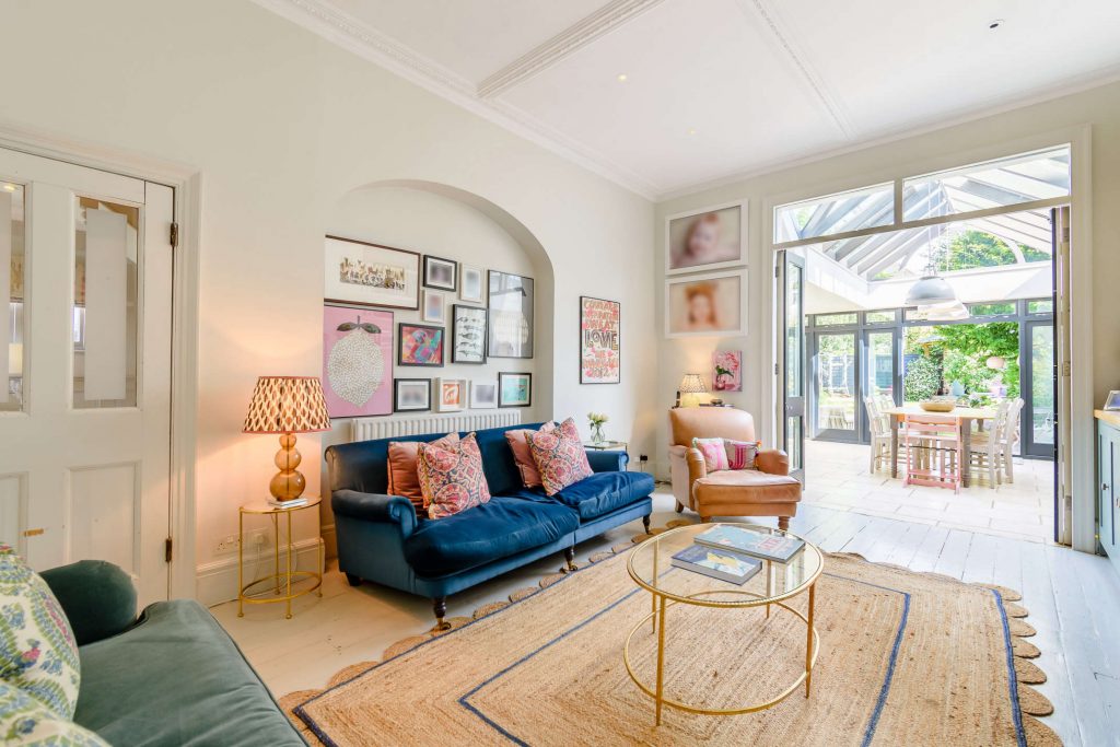 a living room filled with furniture and a large window