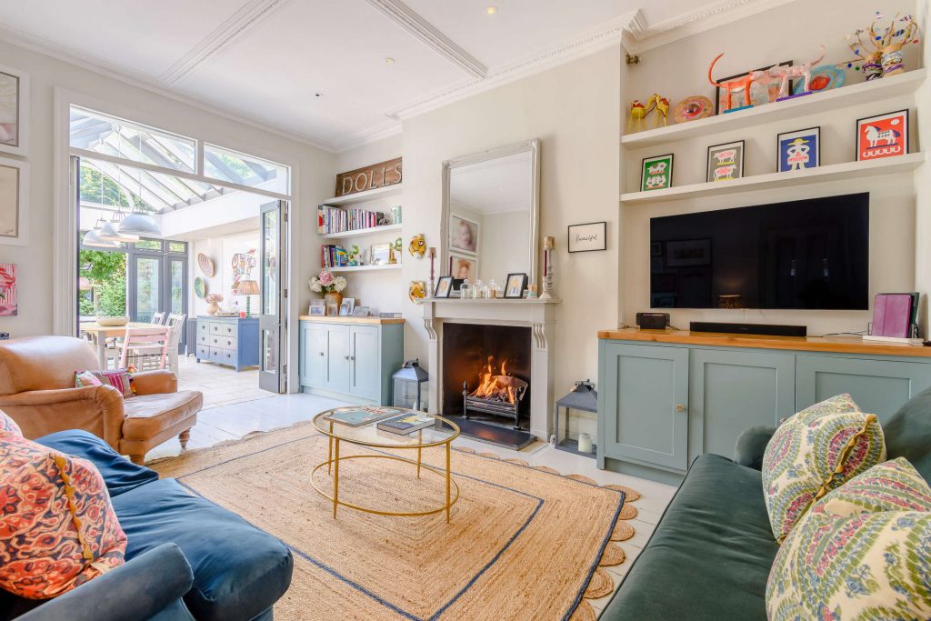 a living room filled with furniture and a large window