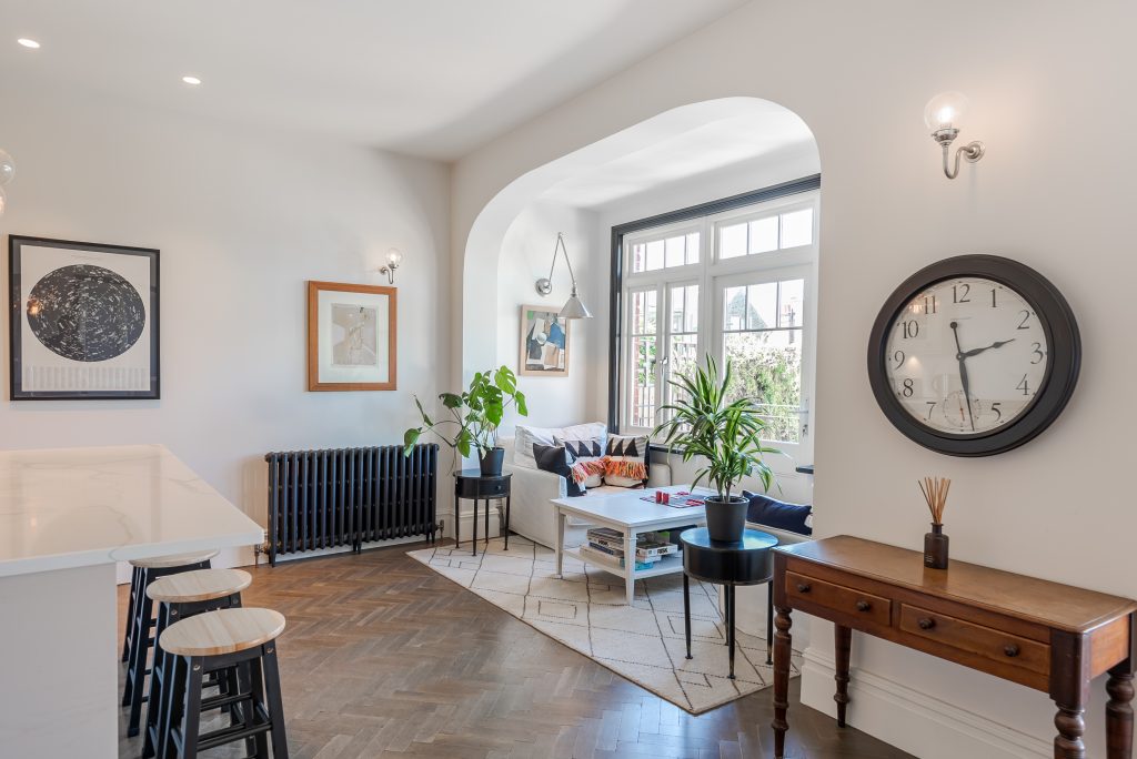 a living room filled with furniture and a fireplace