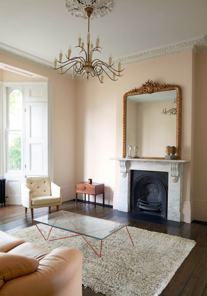 a living room filled with furniture and a fire place