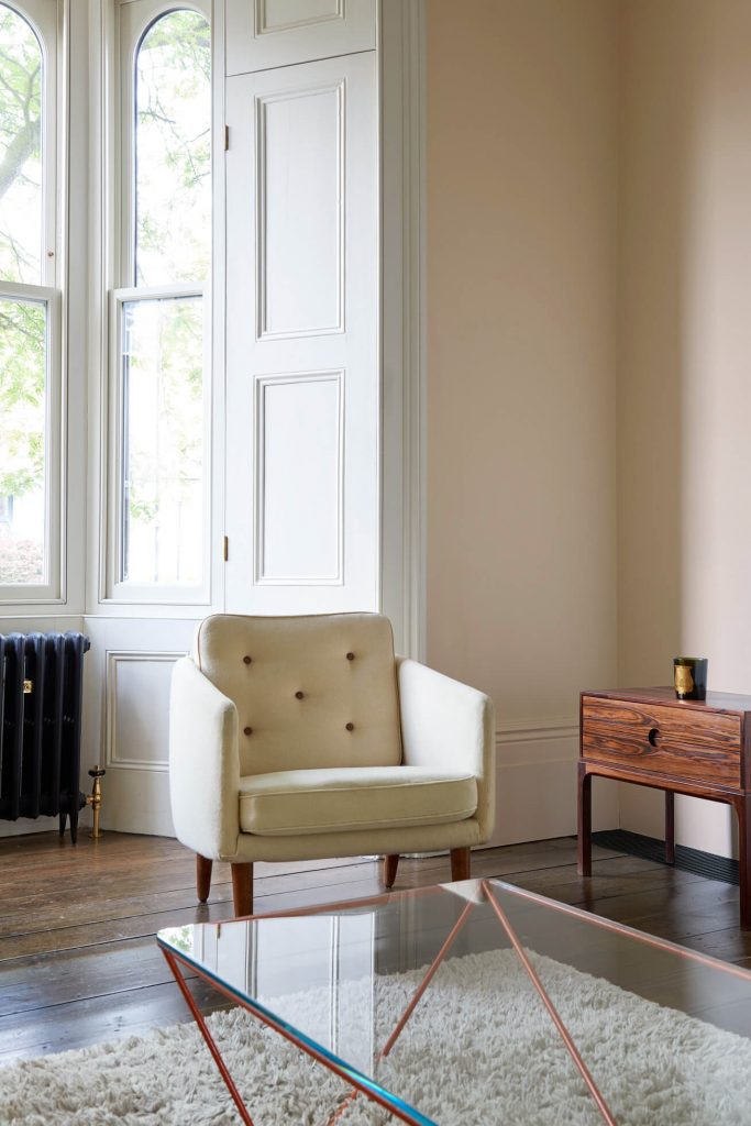a room filled with furniture and a large window