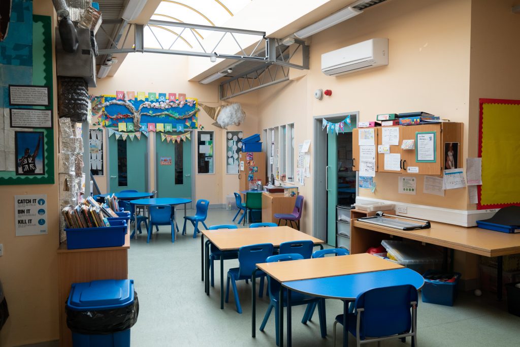 an office with a desk and chair in a room