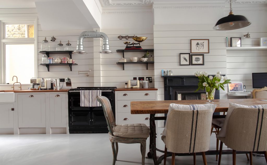 a room filled with furniture and a stove