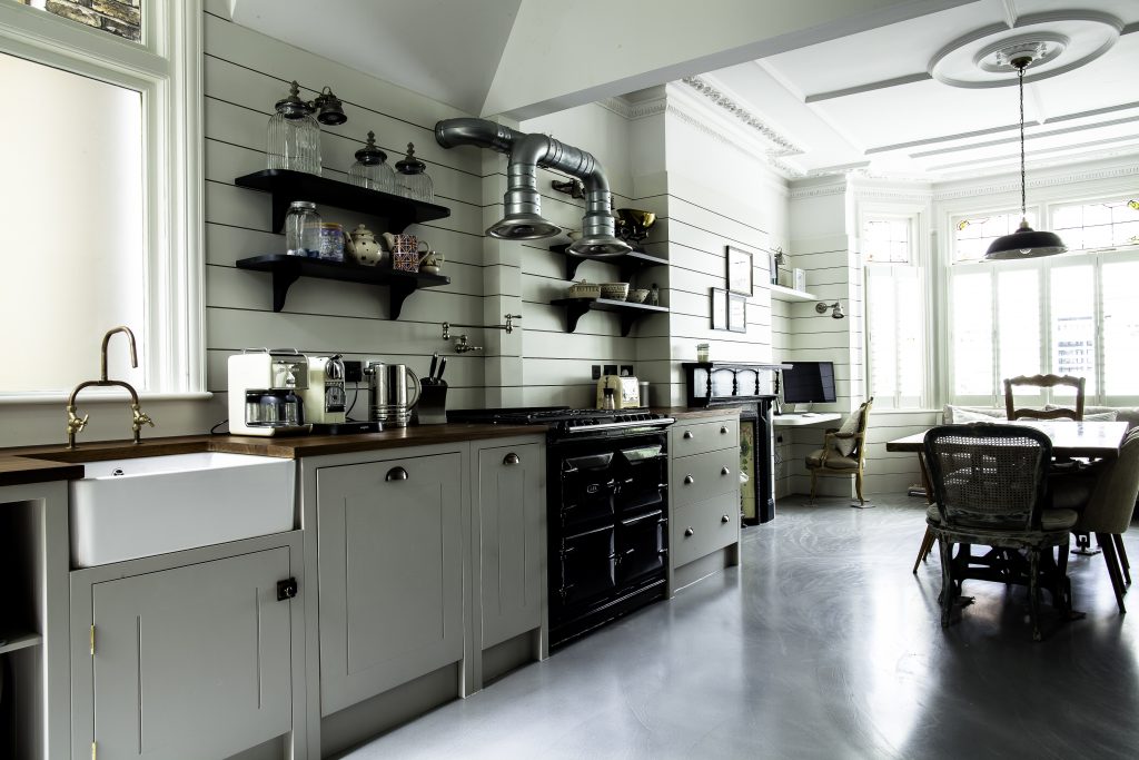 a kitchen filled with lots of furniture