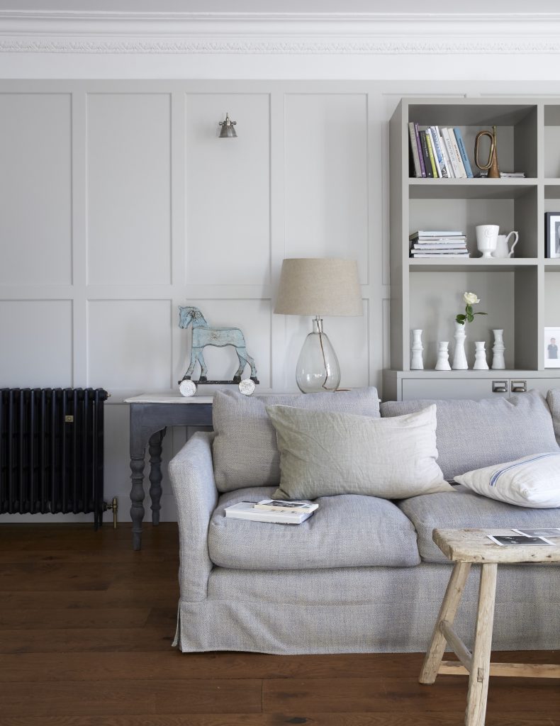 a living room filled with lots of furniture