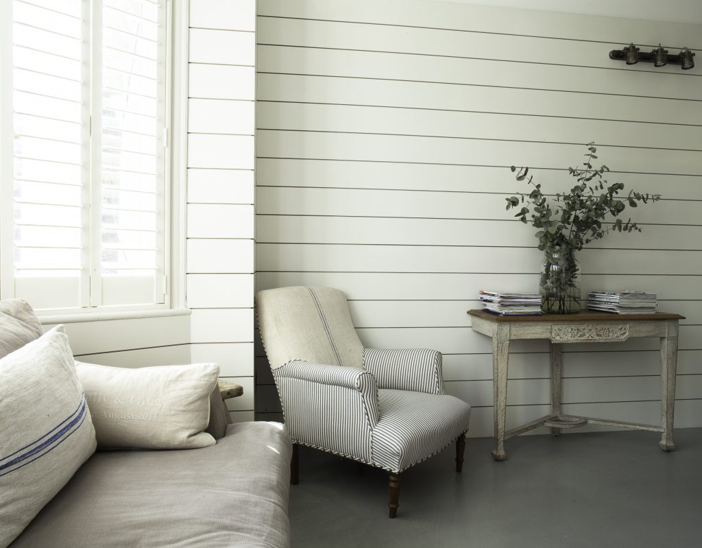 a bedroom with a bed and window in a room