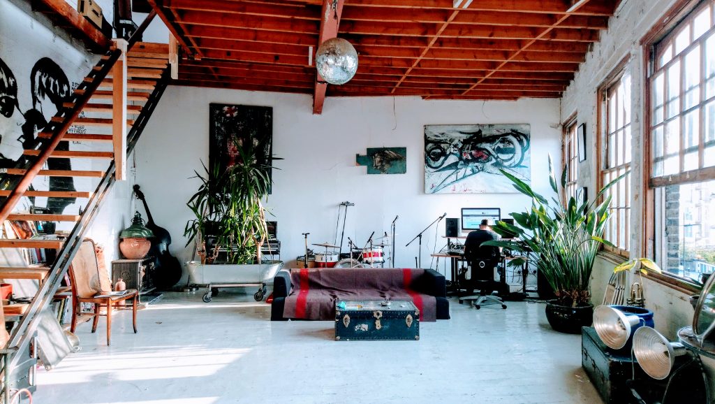 a living area with a building in the background