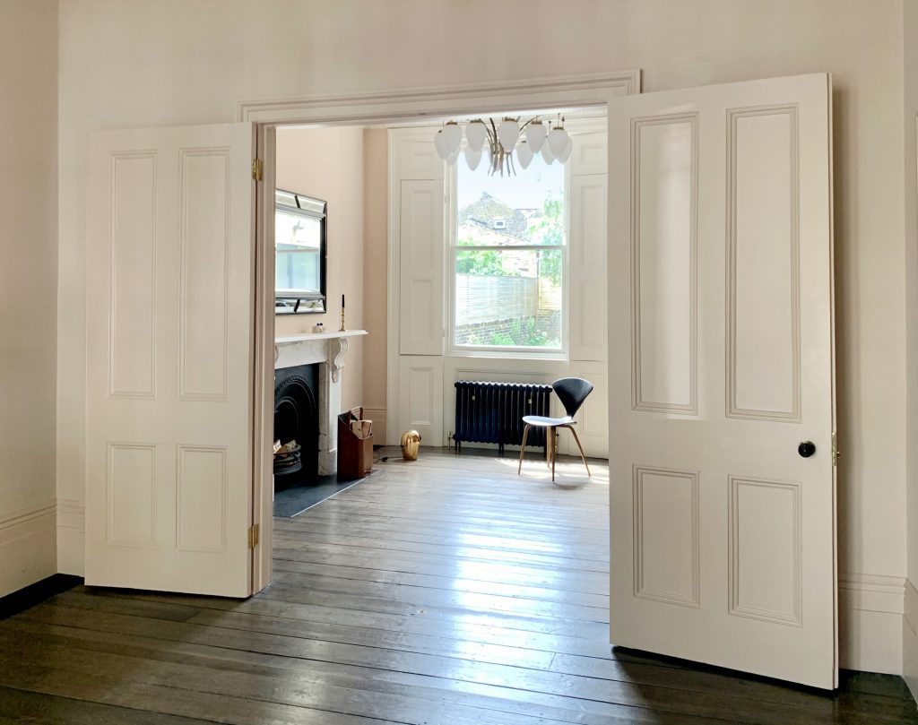 a large empty room with a wooden floor