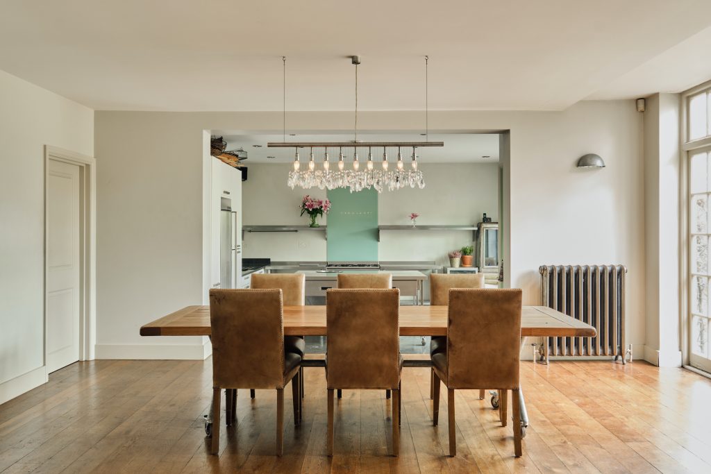 a living room filled with furniture on top of a wooden floor