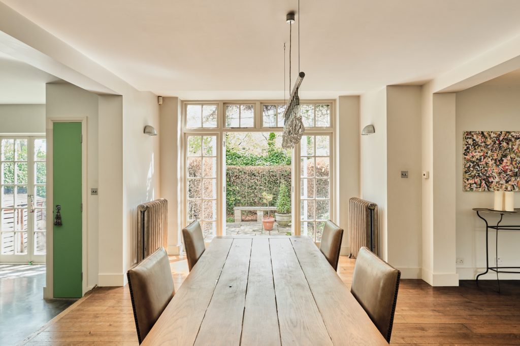 a living room filled with furniture and a large window