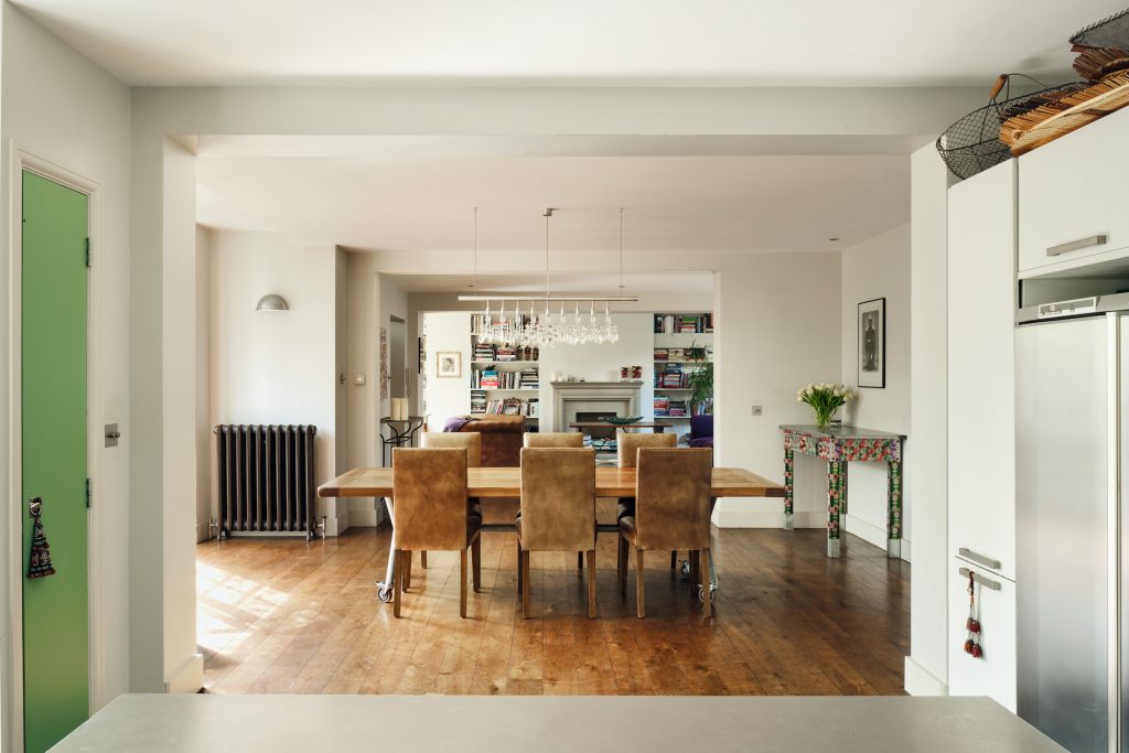 a living room filled with furniture on top of a wooden floor