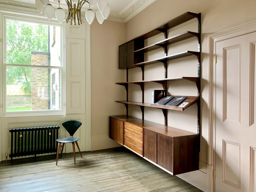 a room filled with furniture and a large window