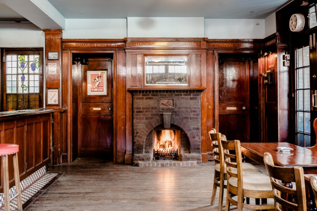 a room filled with furniture and a fireplace