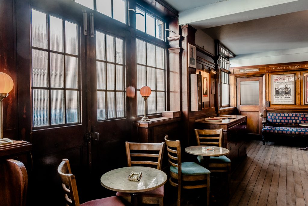 a room filled with furniture and a large window