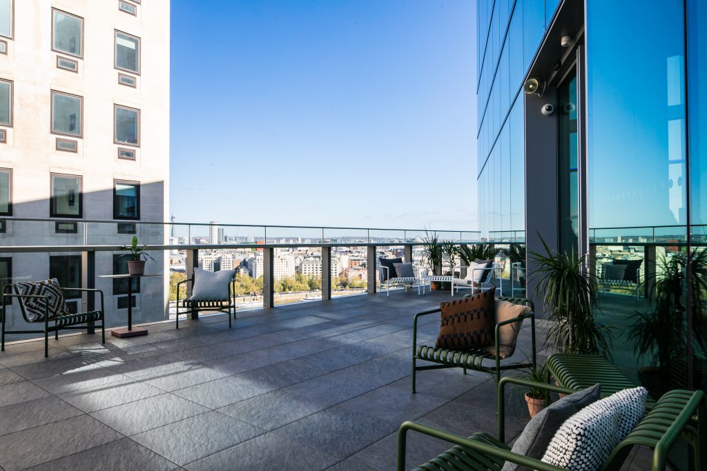 a chair sitting in front of a building