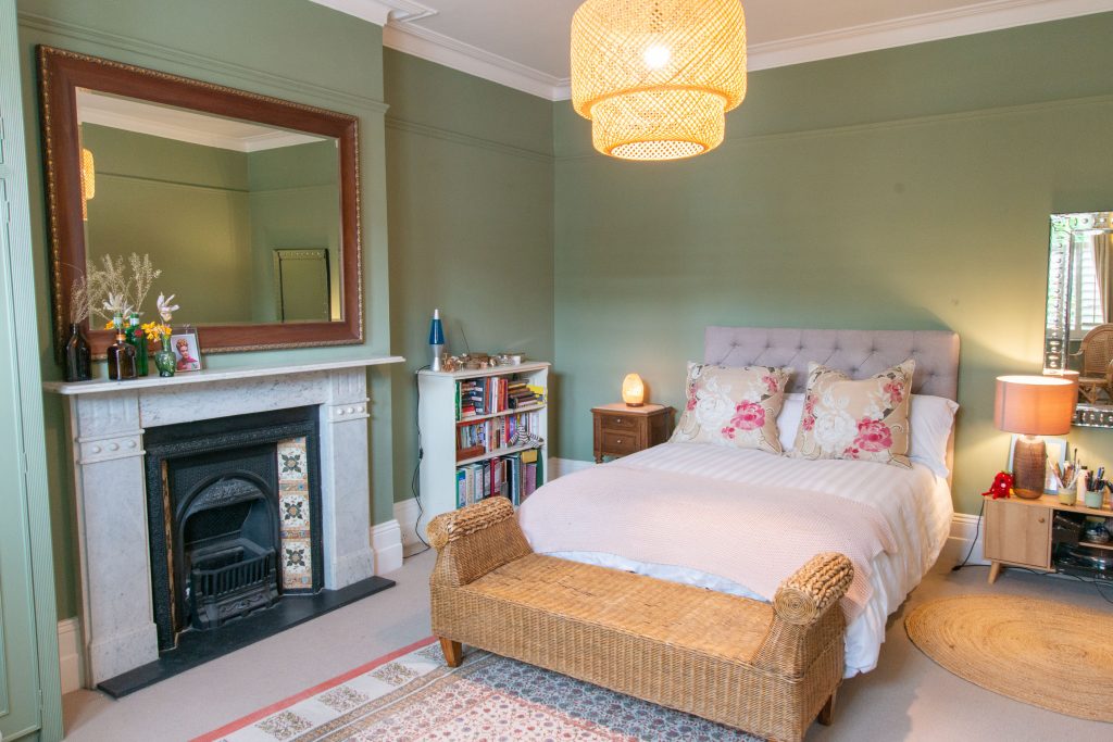 a bedroom with a bed in a room