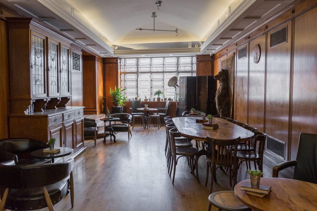 a living room filled with furniture and a large window