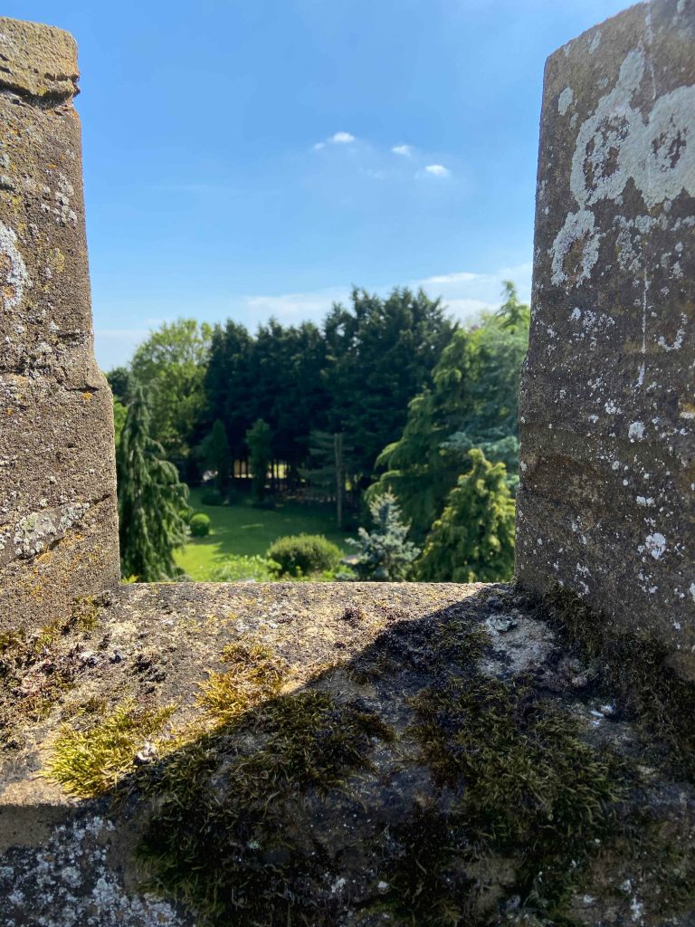 a stone building that has a rocky cliff