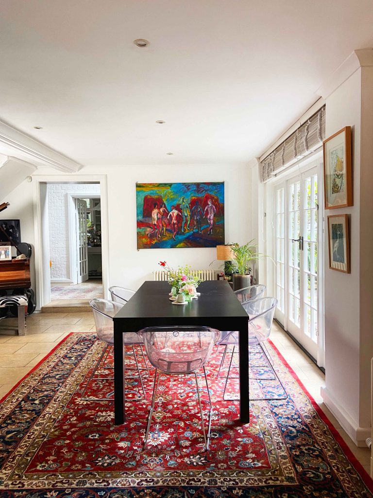 a living room filled with furniture and a rug