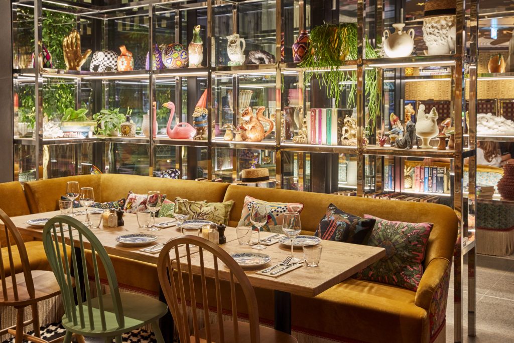 a dining room table in front of a shop