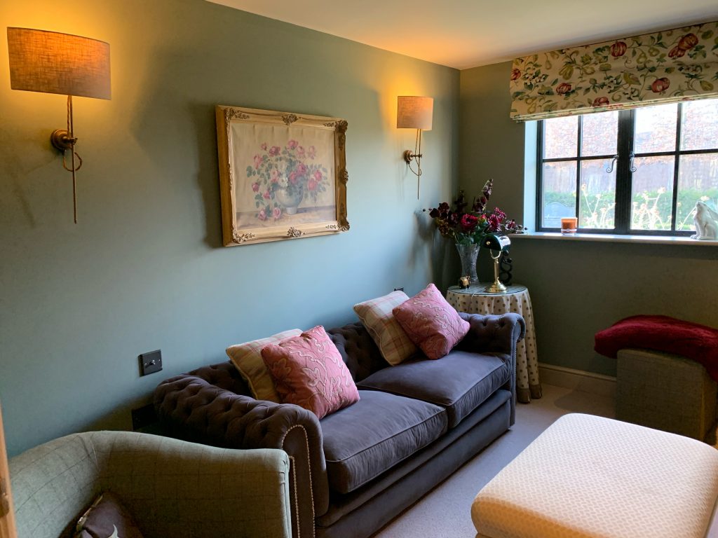 a living room filled with furniture and a fire place