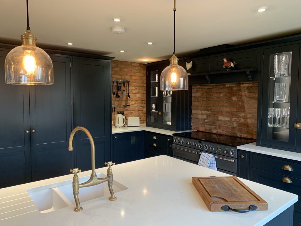 a kitchen with an island in the middle of a room