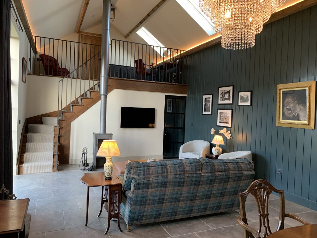 a living room filled with furniture and a large window