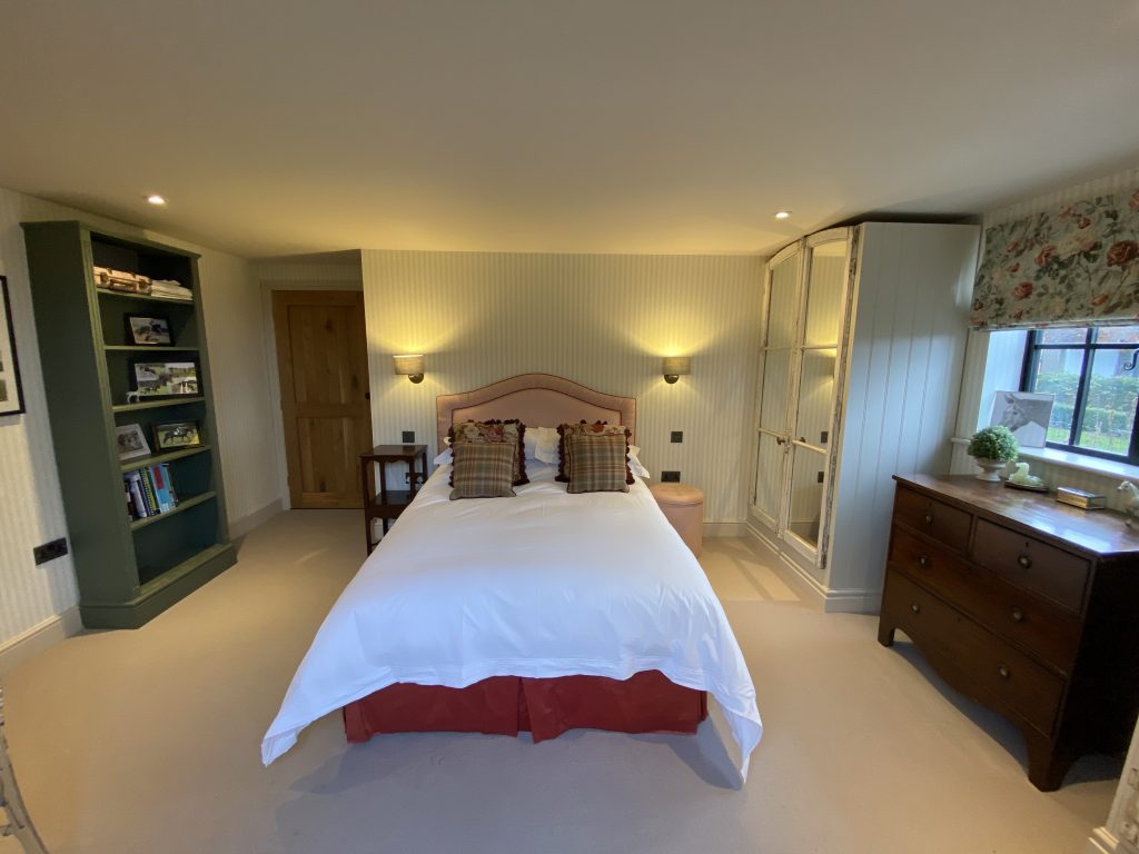 a bedroom with a bed in a room