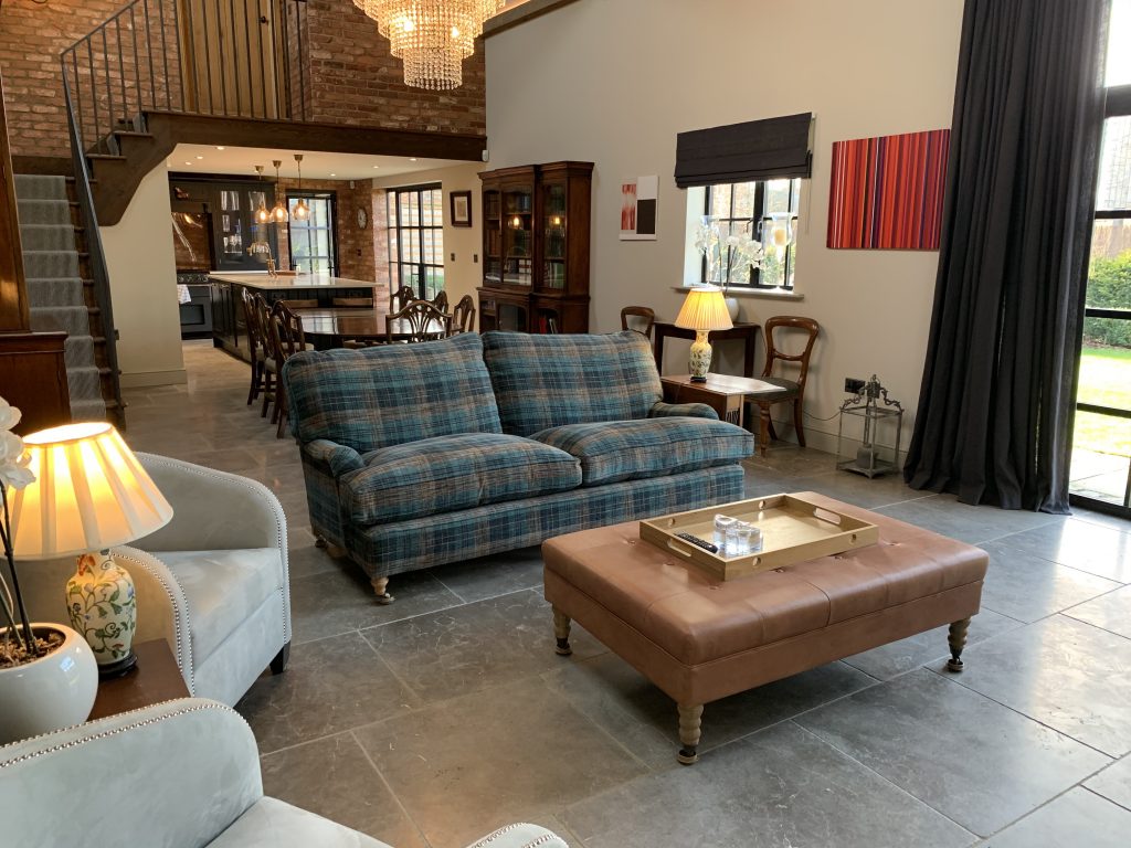 a living room filled with furniture and a fireplace