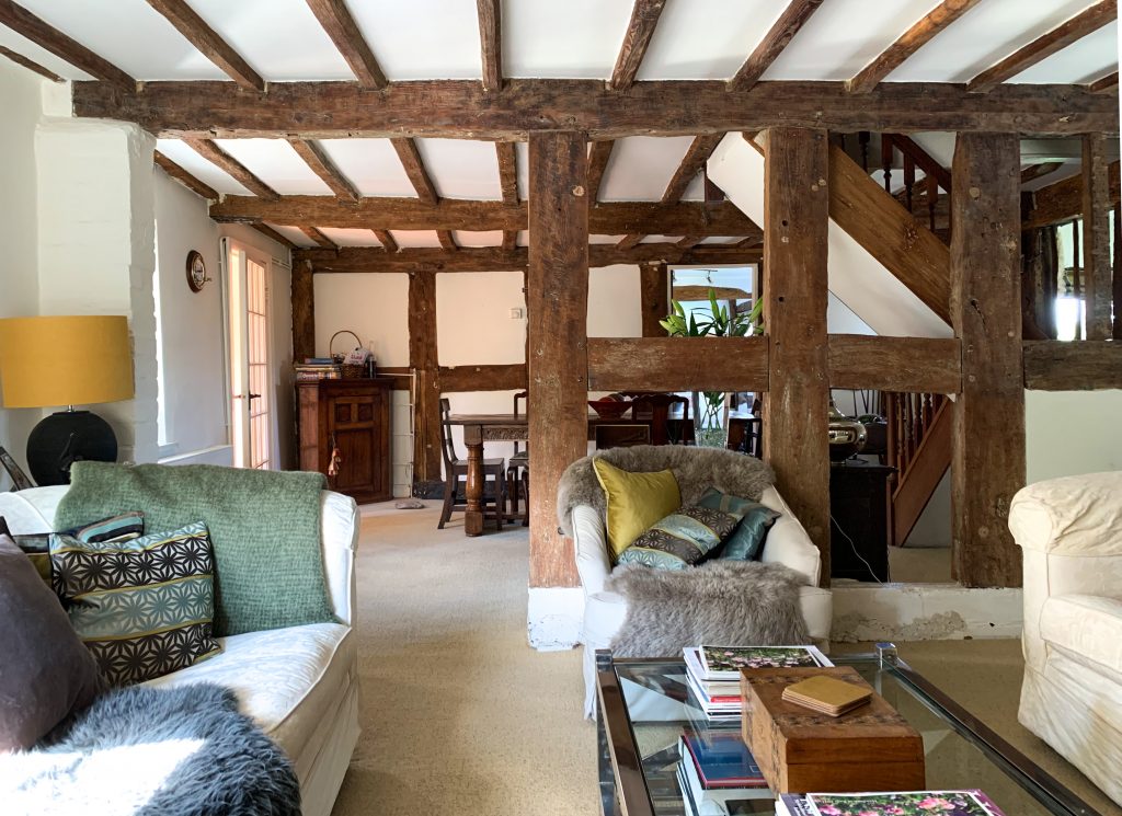 a living room filled with furniture and a large window