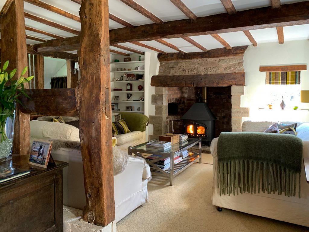 a living room filled with furniture and a fireplace